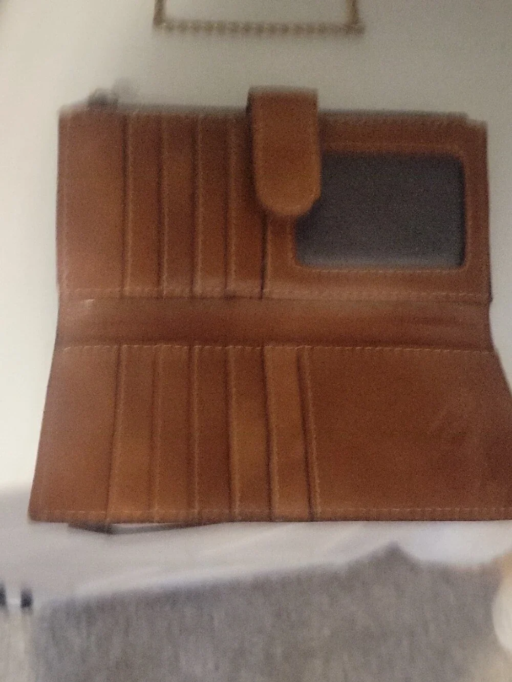 Brown leather Patricia Nash bifold wallet featuring an artistic vintage map back